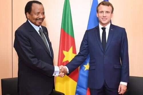 Macron and Paul Biya shaking Hands