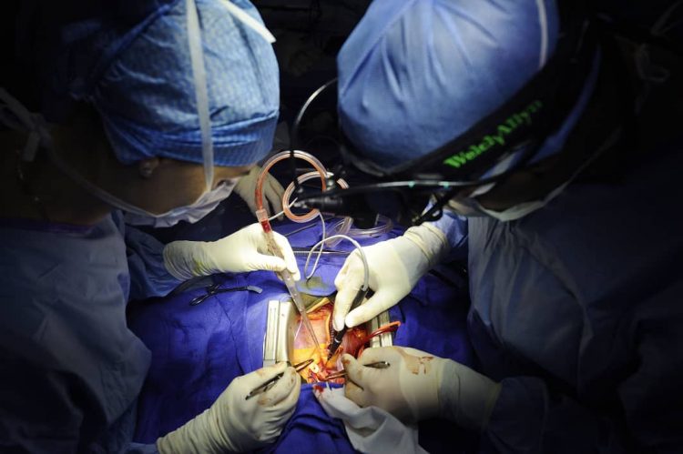 Doctors doing Surgery on a Human